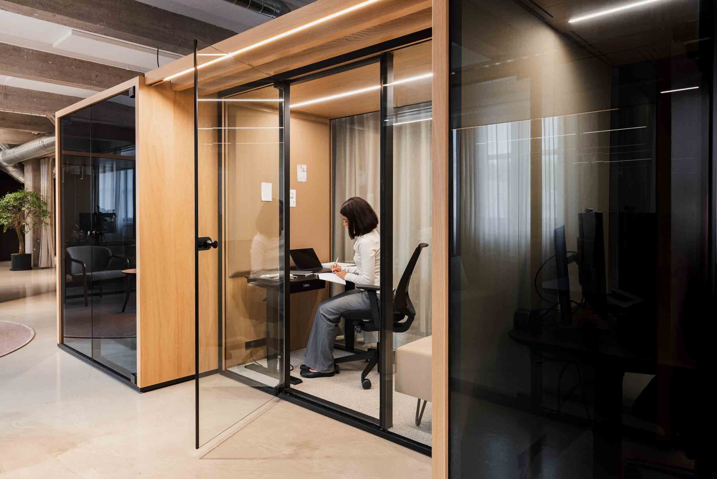 Focus zone in activity-based design. A person working in a soundproof pod